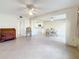 Open concept living and dining area with tile flooring and ceiling fans at 4920 Locust Ne St # 106, St Petersburg, FL 33703