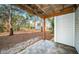 View of backyard and surrounding trees from patio at 514 Ryans Woods Ln, Palm Harbor, FL 34683