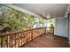 Private balcony overlooking backyard with wooden deck and railing at 514 Ryans Woods Ln, Palm Harbor, FL 34683