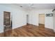 Spacious bedroom with hardwood floors, ensuite bathroom and walk-in closet at 514 Ryans Woods Ln, Palm Harbor, FL 34683