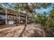 Back exterior of townhouses with private decks and lush landscaping at 514 Ryans Woods Ln, Palm Harbor, FL 34683