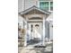 White front door with a decorative arch and sidelights at 514 Ryans Woods Ln, Palm Harbor, FL 34683