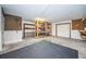 Garage with storage shelving and floor covering at 514 Ryans Woods Ln, Palm Harbor, FL 34683