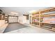 Garage with storage shelving and floor covering at 514 Ryans Woods Ln, Palm Harbor, FL 34683