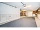 Garage with storage shelving and floor covering at 514 Ryans Woods Ln, Palm Harbor, FL 34683