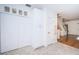 White kitchen cabinets and pantry with hardwood floors at 514 Ryans Woods Ln, Palm Harbor, FL 34683
