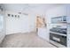 Bright kitchen with white cabinets and tile flooring at 514 Ryans Woods Ln, Palm Harbor, FL 34683