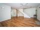 Living room with hardwood floors and staircase at 514 Ryans Woods Ln, Palm Harbor, FL 34683