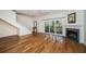 Spacious living room with hardwood floors and a fireplace at 514 Ryans Woods Ln, Palm Harbor, FL 34683