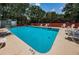 Community pool with lounge chairs and a 5ft depth marker at 514 Ryans Woods Ln, Palm Harbor, FL 34683