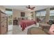 Spacious main bedroom with water views and ceiling fan at 7400 Sun Island S Dr # 411, South Pasadena, FL 33707