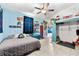 Large bedroom with full bed, loft storage and fun decor at 7424 Lance St, Zephyrhills, FL 33541