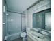 Cozy bathroom featuring a tiled bathtub, toilet, and sink at 8198 Terrace Garden N Dr # 407, St Petersburg, FL 33709