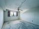 Bedroom featuring a ceiling fan, window and walls with empty space at 8198 Terrace Garden N Dr # 407, St Petersburg, FL 33709
