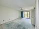 Bedroom with ceiling fan and access to the balcony at 8198 Terrace Garden N Dr # 407, St Petersburg, FL 33709