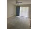 Empty bedroom with new flooring, ceiling fan and window coverings at 8198 Terrace Garden N Dr # 407, St Petersburg, FL 33709