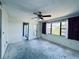 Bedroom with a ceiling fan and a large window at 8198 Terrace Garden N Dr # 407, St Petersburg, FL 33709