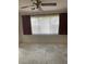 Empty bedroom with new flooring, ceiling fan and window coverings at 8198 Terrace Garden N Dr # 407, St Petersburg, FL 33709