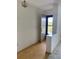 Bright entryway with wood-look floors and exterior door at 8198 Terrace Garden N Dr # 407, St Petersburg, FL 33709