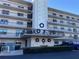Building exterior featuring a multi-story building with balconies and landscaping at 8198 Terrace Garden N Dr # 407, St Petersburg, FL 33709