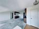 Bright living room with retro cabinets, and a vintage chandelier at 8198 Terrace Garden N Dr # 407, St Petersburg, FL 33709