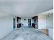 Bright living room featuring built-in cabinets, and an open layout ready for renovations at 8198 Terrace Garden N Dr # 407, St Petersburg, FL 33709