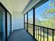 A screened-in patio featuring views of the pond and green landscape at 8198 Terrace Garden N Dr # 407, St Petersburg, FL 33709