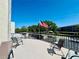 Outdoor patio featuring seating, a railing, and an American flag at 8198 Terrace Garden N Dr # 407, St Petersburg, FL 33709