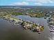 Aerial view of property with private dock and water access at 8510 Magnolia St, Gibsonton, FL 33534