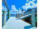 Dock area of a home features a sun deck and boat lift for easy access to waterway at 8680 Quinn Ct, North Port, FL 34287