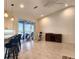 Open floor plan with a modern bar, large sliding doors and outdoor living space at 8680 Quinn Ct, North Port, FL 34287