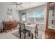 Cozy dining area with table for four and built-in hutch at 9022 Ramsgate Dr # 9022, New Port Richey, FL 34655