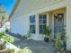 Front entrance with landscaping and potted plants at 9022 Ramsgate Dr # 9022, New Port Richey, FL 34655