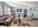 Living room with hardwood floors, comfortable seating, and built-in shelving at 9022 Ramsgate Dr # 9022, New Port Richey, FL 34655