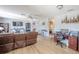 Open living room with hardwood floors, leather seating, and home office area at 9022 Ramsgate Dr # 9022, New Port Richey, FL 34655