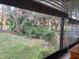 Landscaped backyard with lush green grass at 10 Woodridge Cir, Oldsmar, FL 34677