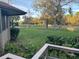 Lush backyard view overlooking greenery and a golf course in the distance at 10 Woodridge Cir, Oldsmar, FL 34677
