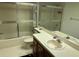 Bathroom with shower/tub combo and vanity at 10 Woodridge Cir, Oldsmar, FL 34677