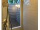 The bathroom features a walk-in shower and a view of the outside at 10 Woodridge Cir, Oldsmar, FL 34677