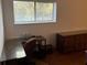 Bright bedroom featuring a desk near the window for a functional workspace at 10 Woodridge Cir, Oldsmar, FL 34677