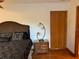 Spacious bedroom with a large bed and wooden nightstand at 10 Woodridge Cir, Oldsmar, FL 34677