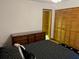 Bedroom with a queen-size bed and built-in dresser at 10 Woodridge Cir, Oldsmar, FL 34677