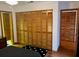 Ample closet space with wooden slat doors, providing storage in this home at 10 Woodridge Cir, Oldsmar, FL 34677