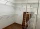 Large walk-in closet with built in shelves and hanging racks at 10 Woodridge Cir, Oldsmar, FL 34677