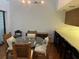 Open concept dining area features a round table and chairs at 10 Woodridge Cir, Oldsmar, FL 34677