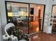 View of dining room leading to kitchen and sunroom with bright natural light at 10 Woodridge Cir, Oldsmar, FL 34677