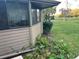Exterior view showing partial home and landscaping at 10 Woodridge Cir, Oldsmar, FL 34677