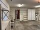 Garage with storage cabinets and exterior access at 10 Woodridge Cir, Oldsmar, FL 34677