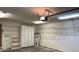Garage with shelving units and cabinets for organized storage solutions at 10 Woodridge Cir, Oldsmar, FL 34677