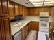 Well-lit kitchen featuring stainless steel appliances and plenty of counter space at 10 Woodridge Cir, Oldsmar, FL 34677